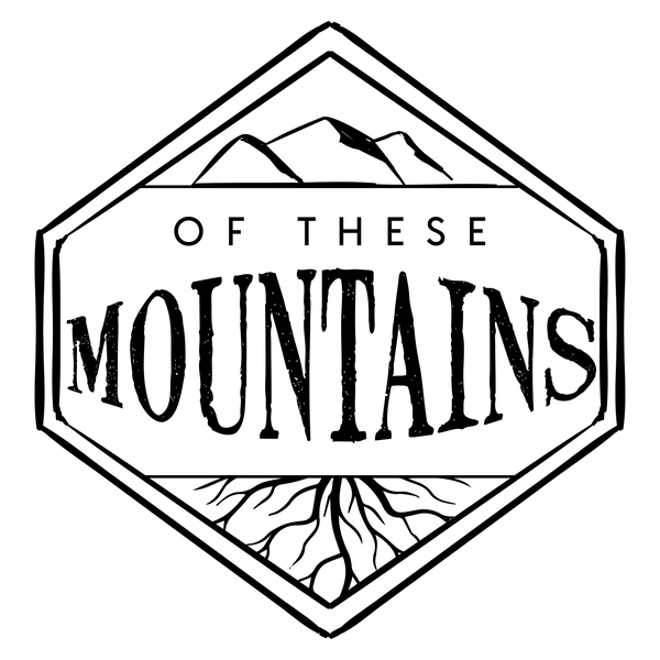 Of These Mountains logo