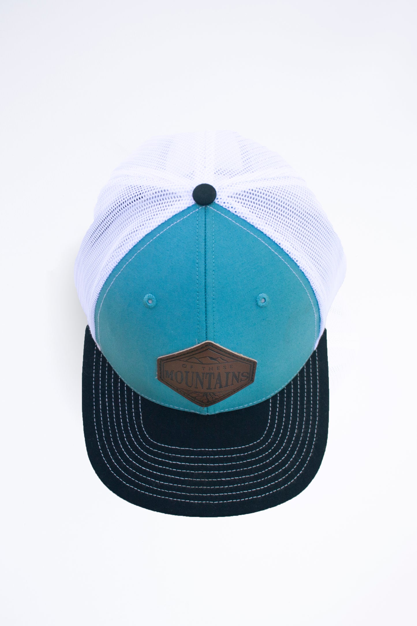 Of These Mountains Bluebird Trucker Hat