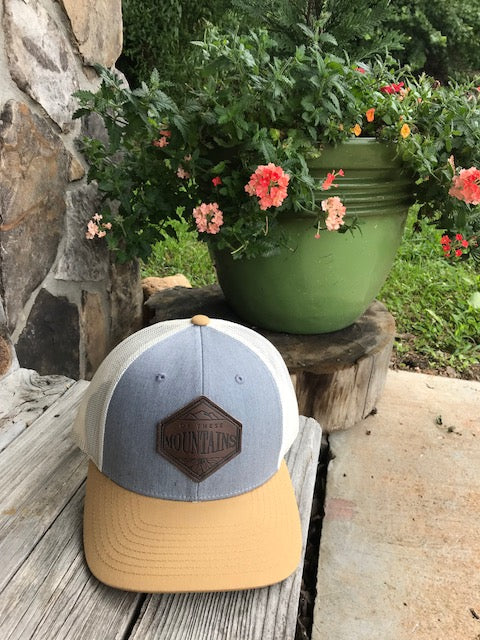 Of These Mountains Loving Leather Patch Trucker Hat